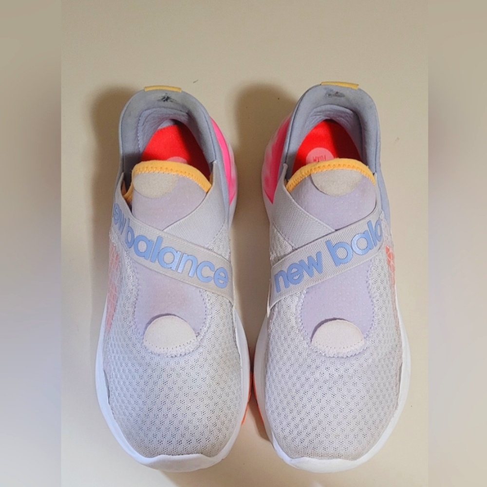 New Balance Sneakers, Womens size 81/2. Shoe color mainly light gray,splash pink